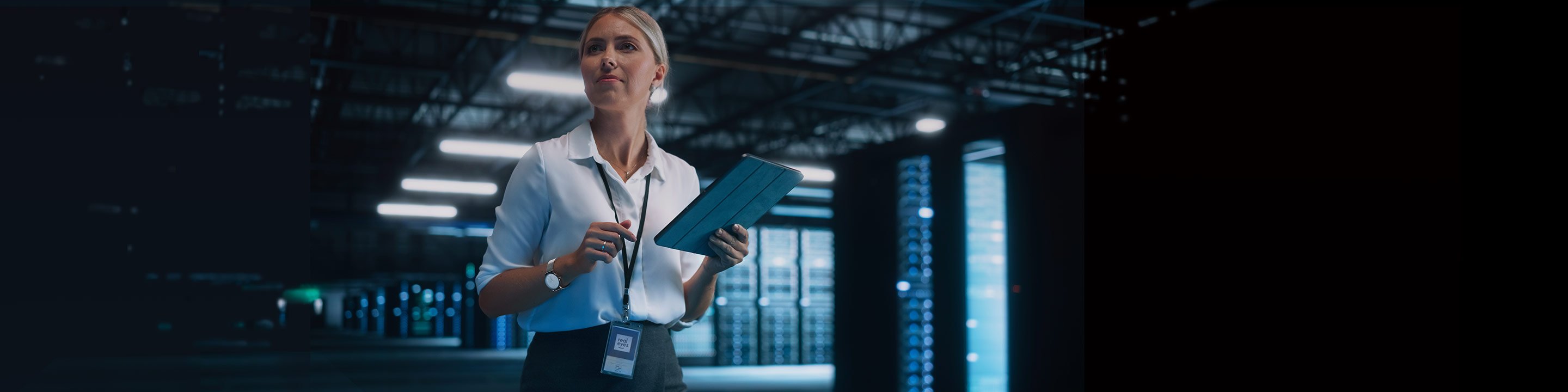 Woman in a data farm holding tablet