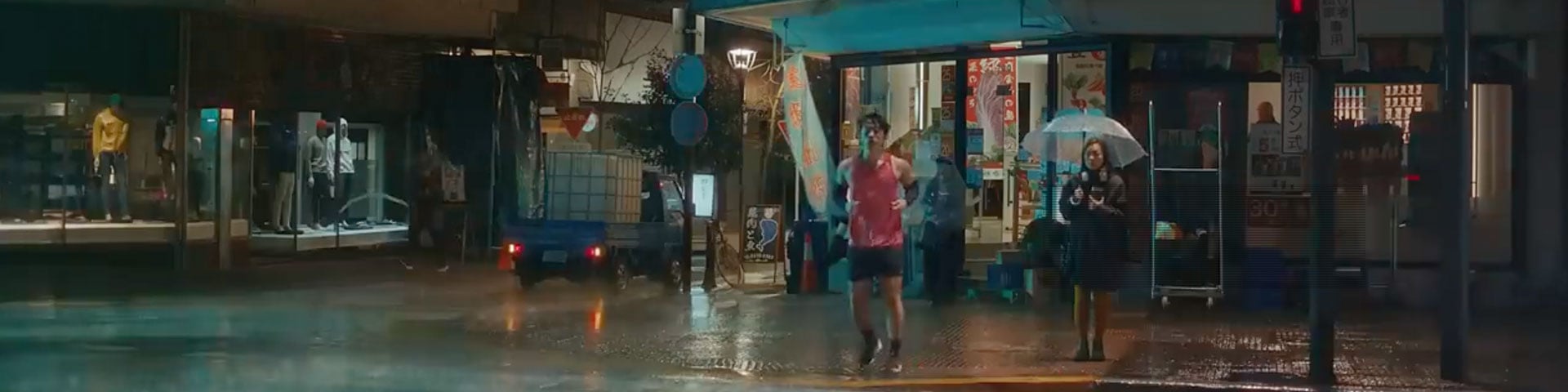 Man running at night in the rain
