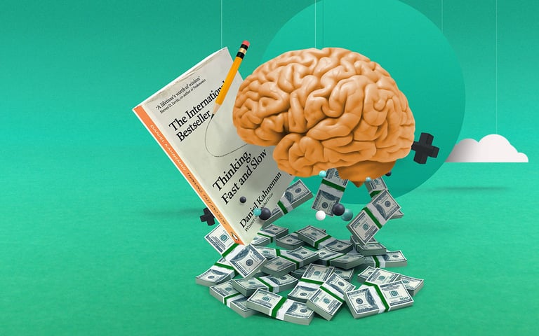 A brain next to Daniel Kahneman's book 'Fast and Slow Thinking'