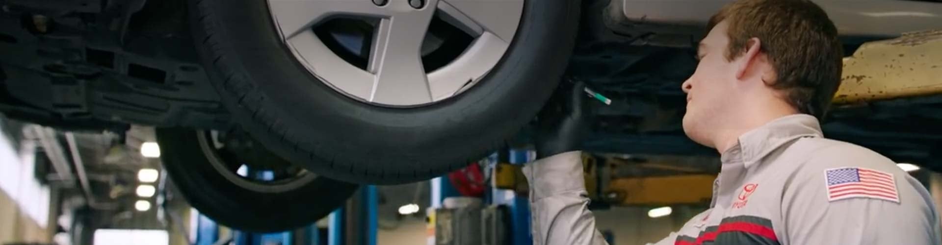 Toyota Engineer Checking Underneath Car