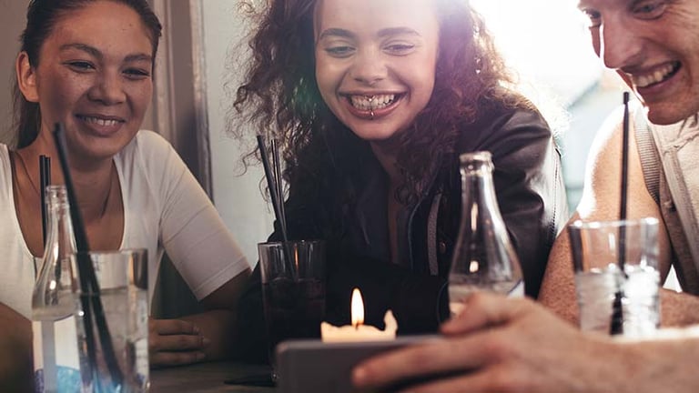 A small social gathering watching short-form-video